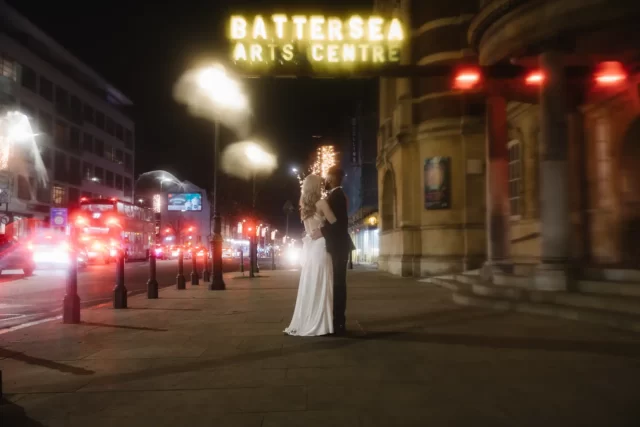 Couple in front of Battersea Arts Centre at night, Battersea Arts Centre. Photography by Wedding Photography